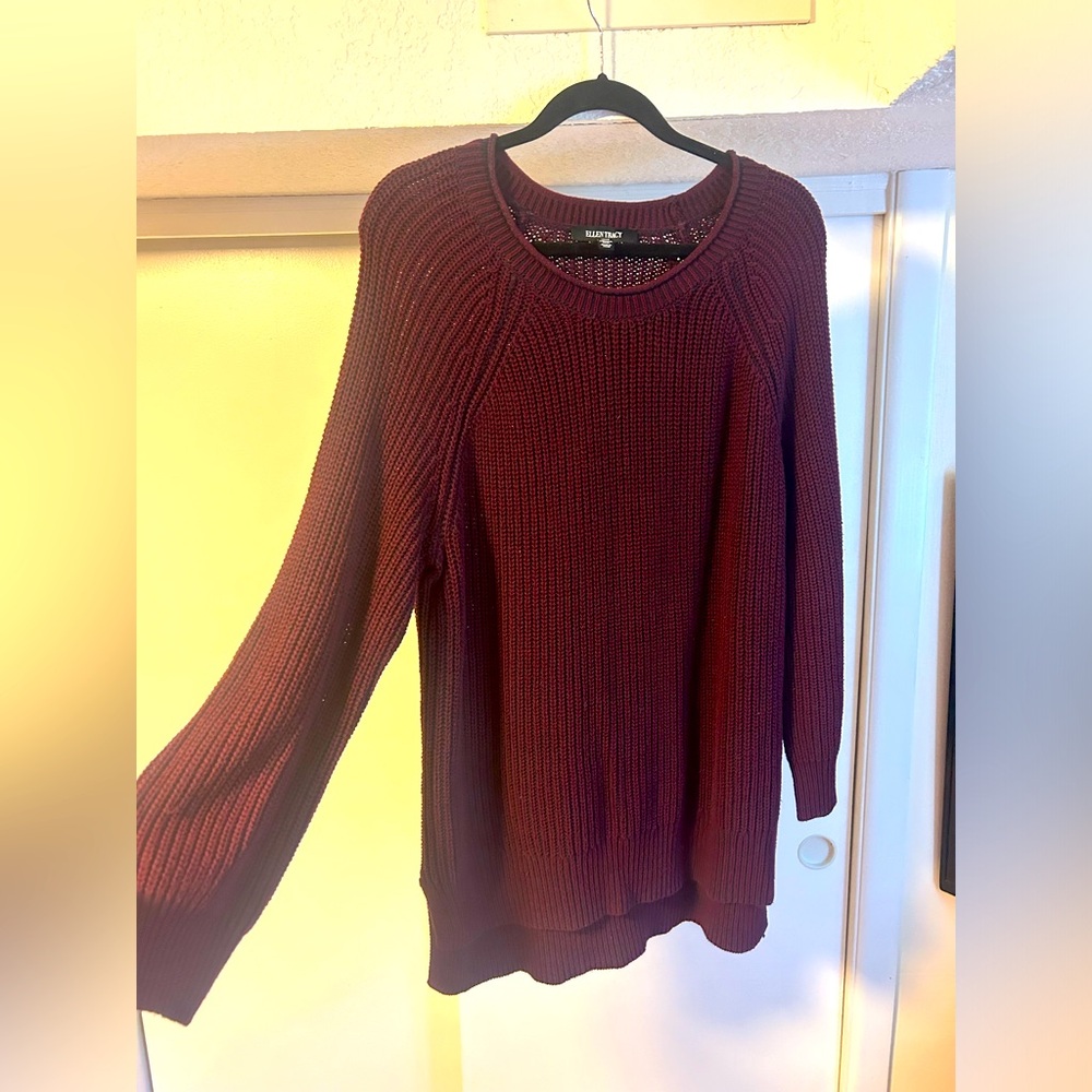Knit, thick maroon sweater. Cozy, long and a little oversized.